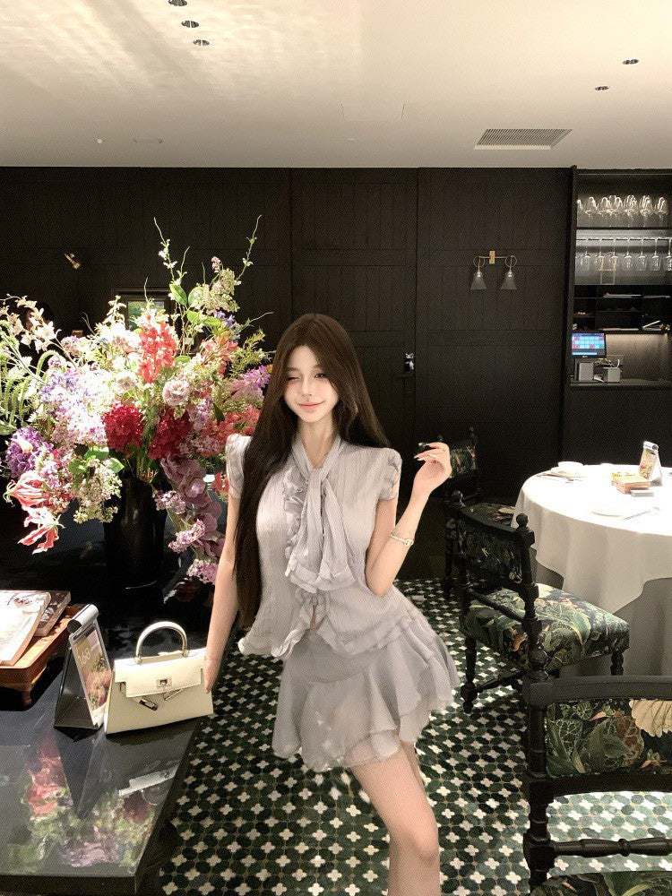 NA+ 南洋千金雪紡飄逸荷葉上衣 不規則半身裙 藍灰