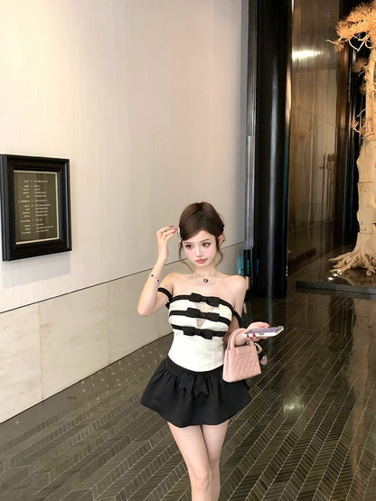 NA+ 黑白撞色女爵一字領蝴蝶結條紋上衣