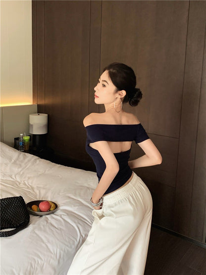 Na+ 歐美辣妹不規則一字露背彈力上衣 藍