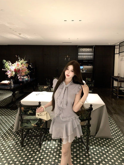 NA+ 南洋千金雪紡飄逸荷葉上衣 不規則半身裙 藍灰