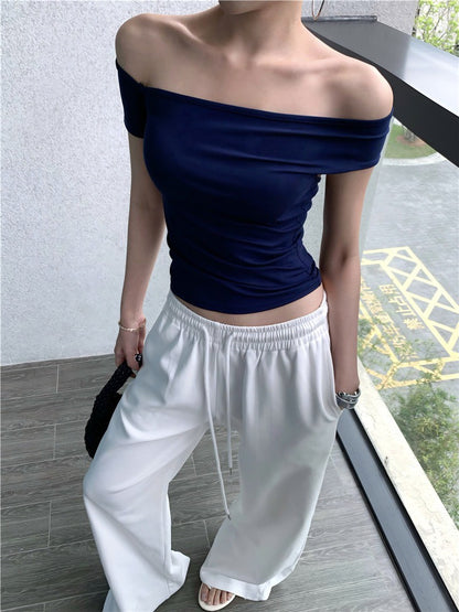 Na+ 歐美辣妹不規則一字露背彈力上衣 藍